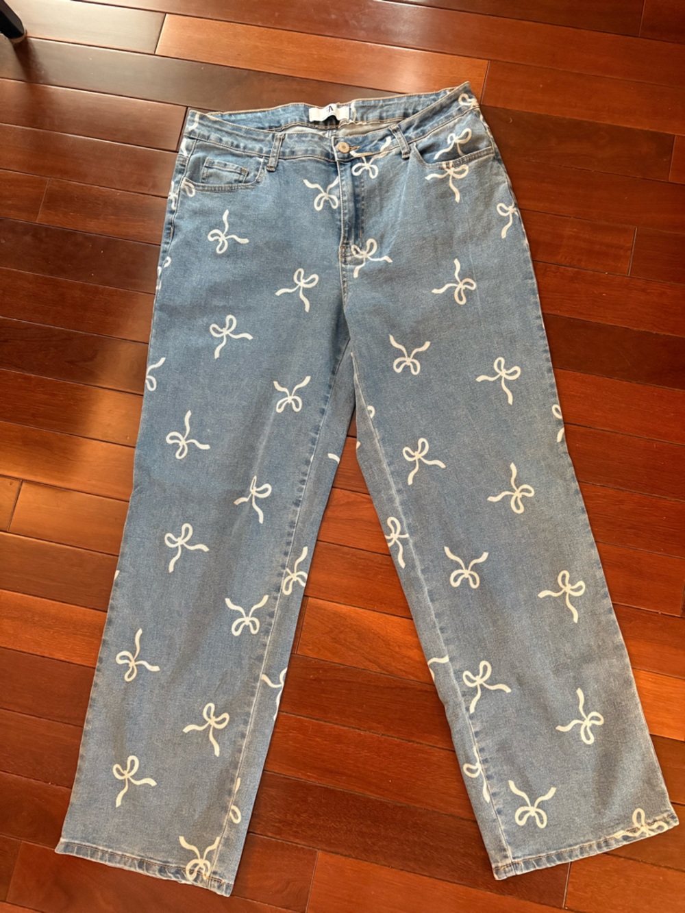 Light Blue Wide Leg Jeans with White Bow Print